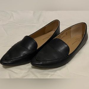 Black faux leather pointed toe flats